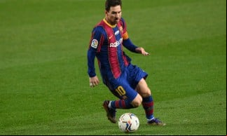Lionel Messi em ação pelo Barcelona na temporada 2020/2021